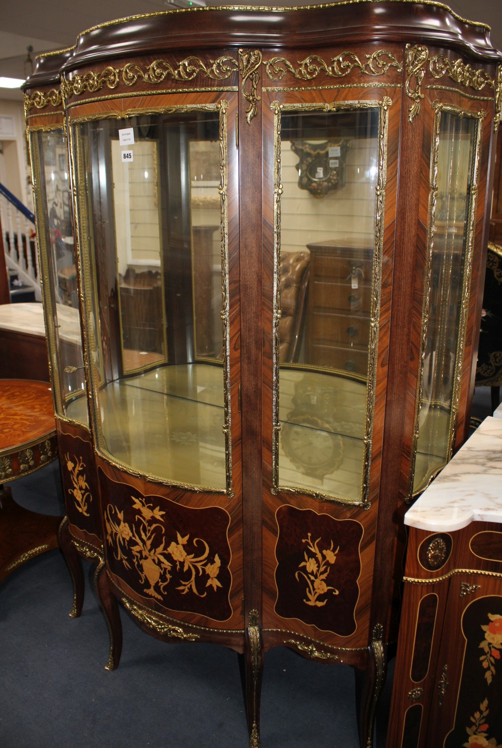 A Meuble Francais marquetry inlaid bowfront vitrine, W.124cm D.52cm H.177cm